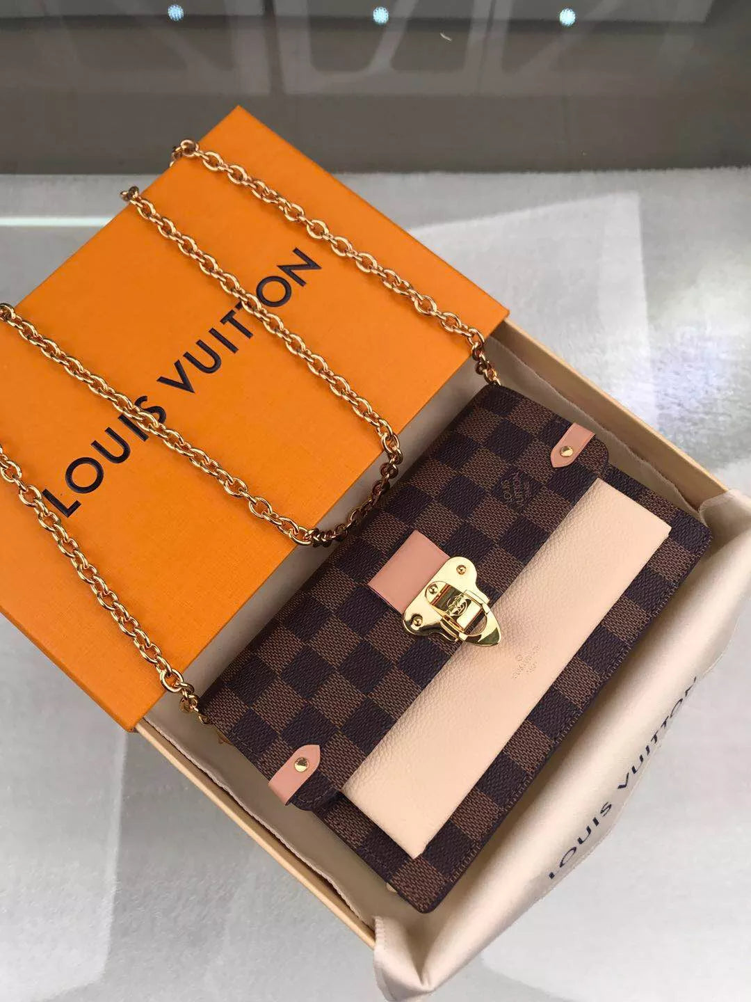 LOUIS VUITTON VAVIN CHAIN WALLET