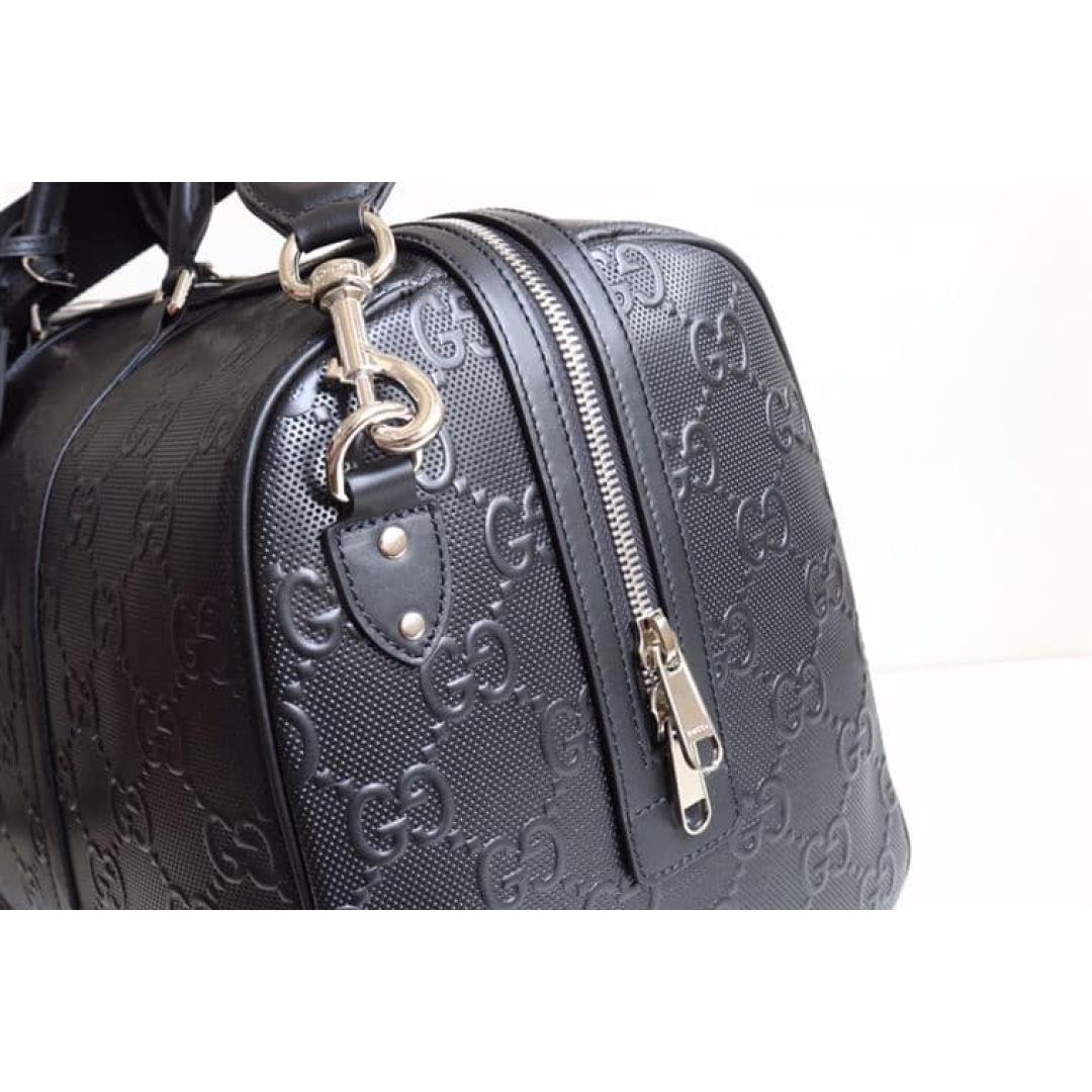 GUCCI GG EMBOSSED DUFFLE BAG