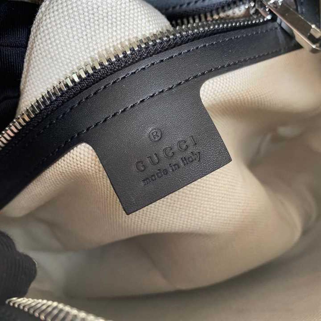 GUCCI GG EMBOSSED SHOULDER BAG IN BLACK LEATHER